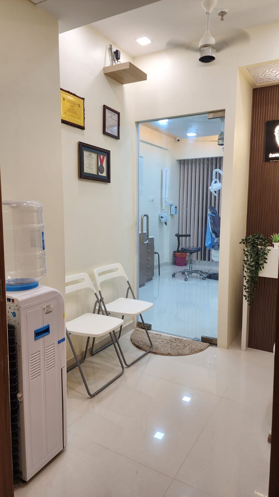 Waiting area at Smile Align, looking through the glass door to the treatment room